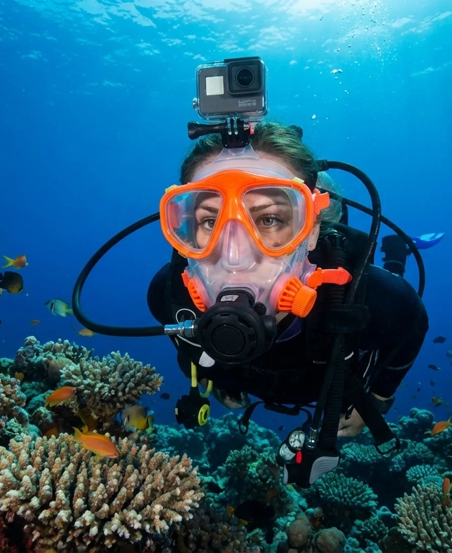 Technical diver underwater wearing a drysuit and full-face mask